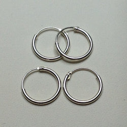 E078 1.2 x 12mm Silver Hoop Earring