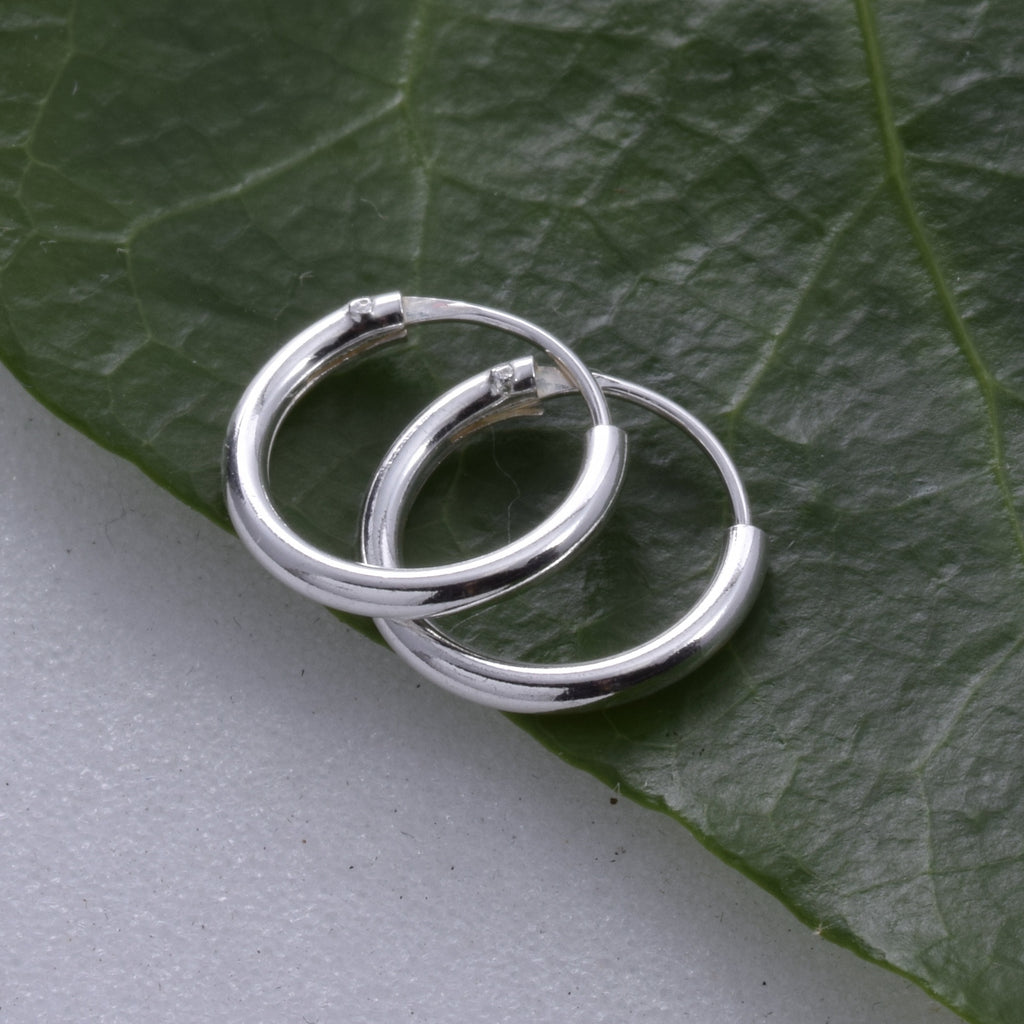 E077 - 1.2 x 10mm Silver Hoop Earring