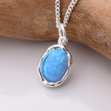 P1075 - 925 silver and recon blue opal pendant