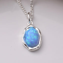 P1075 - 925 silver and recon blue opal pendant