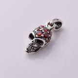 P878 - 925 Silver skull with red CZ stones
