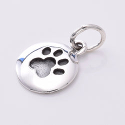 P757 - Silver paw print disc pendant