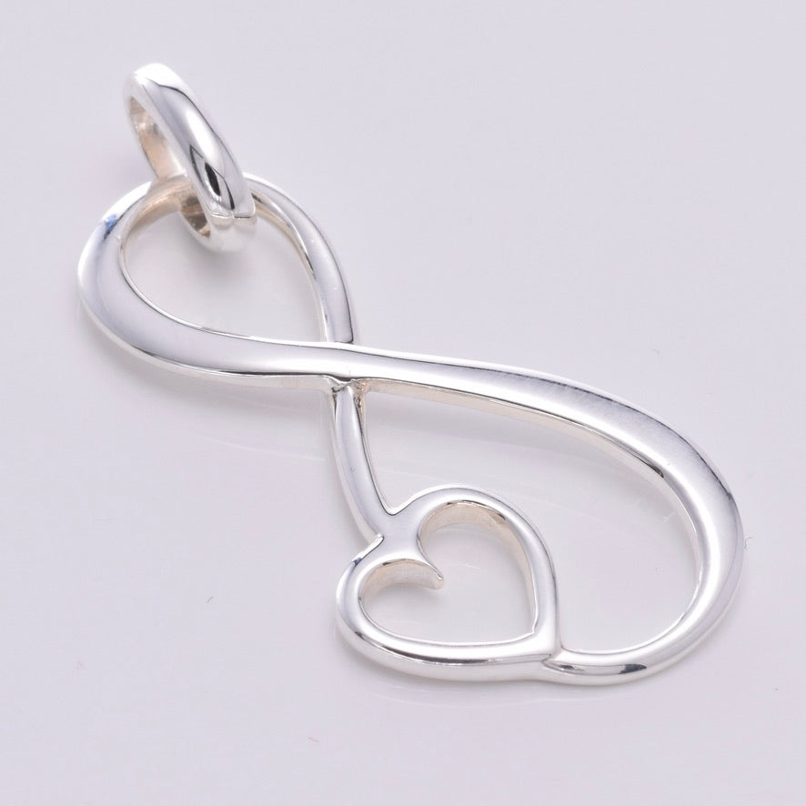 P693 - Large infinity loop with heart pendant – Java Designs