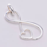 P693 - Large infinity loop with heart pendant