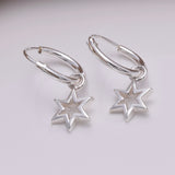 E645 - Silver hoop and six point star earrings