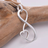 P693 - Large infinity loop with heart pendant