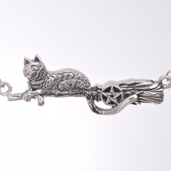P443 - Cat on a broomstick necklace
