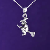 P648 - Witch on broomstick pendant