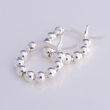 E562 - Silver string of beads hoop earrings 14mm